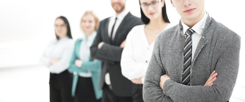 young businessman standing in front of his business team.photo with copy space