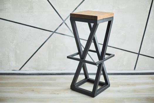 stylish bar chair made of wood and metal. photo with copy space