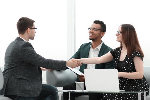 business partners shaking hands over the table negotiation . concept of cooperation