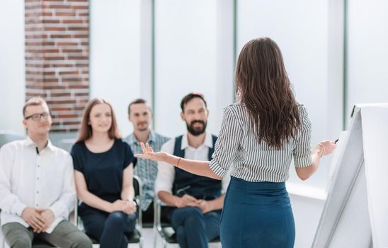 business woman conducting a seminar for her business team. business and education