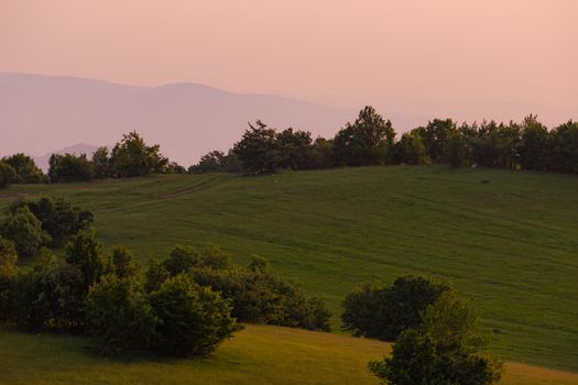 landscape of  summer nature in sunset in mountains and hills on countryside abstract lines and curves background