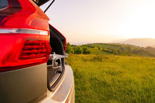 drone ready for fly in suv trunk landscape nature mountains sunset