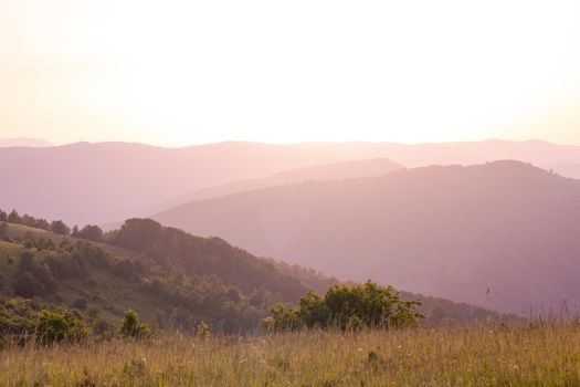 landscape of  summer nature in sunset in mountains and hills on countryside abstract lines and curves background