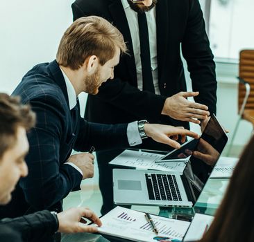 successful business team discussing a new financial plan of the company in the workplace in the office