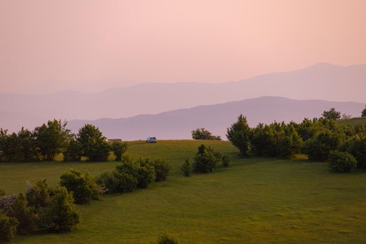 landscape of  summer nature in sunset in mountains and hills on countryside abstract lines and curves background