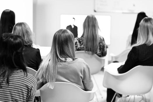 rear view.blurred image of people in the conference room.business background