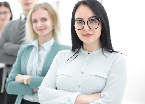 confident businesswoman standing in front of his business team.photo with copy space