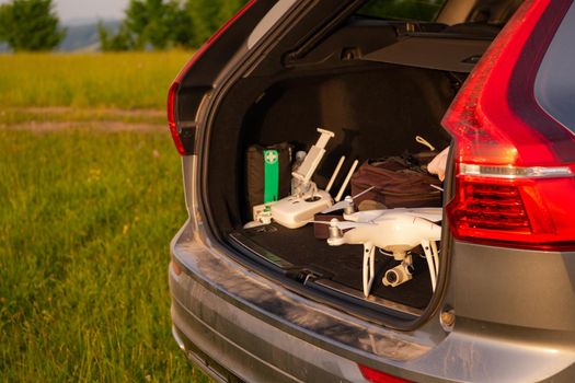 drone ready for fly in suv trunk landscape nature mountains sunset