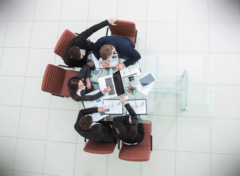 top view of successful business team working on a financial report on the company's profits.the photo has a empty space for your text