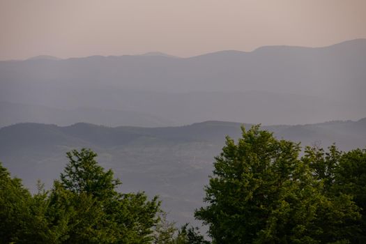 landscape of  summer nature in sunset in mountains and hills on countryside abstract lines and curves background