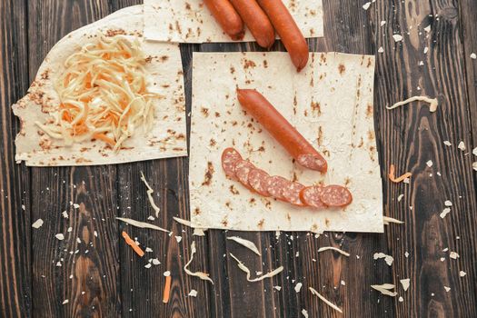 ingredients of a burrito,isolated on wooden background.