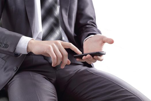 close up. businessman tapping the screen of the mobile phone.photo with copy space