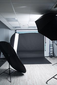 black photophone in an empty modern photo Studio. photo with copy space