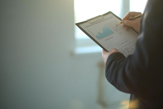 close up.businessman studies a financial document.photo with copy space