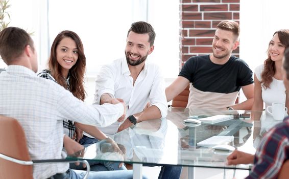 handshake of business partners at the meeting in the office