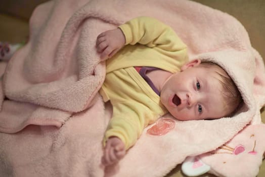 cute  little newborn baby smilling  at home