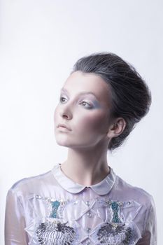 portrait of a fashionable young lady with a fashionable hairstyle . beauty and fashion