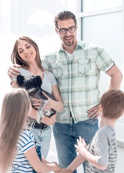 happy family standing in new apartment .photo with copy space