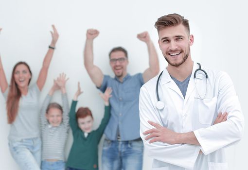 portrait of a family doctor on the background of his happy patients. photo with copy space