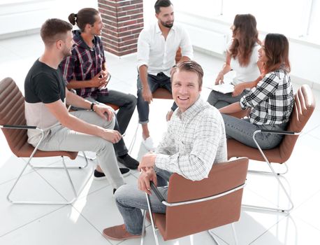 smiling boss sitting at the workshop.the concept of successful work