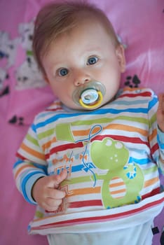 cute  little newborn baby smilling  at home