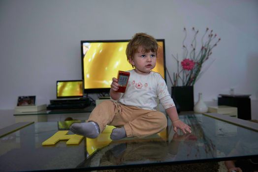 Adorable cute beautiful little baby girl playing with toys at home. Happy healthy child having fun with toy Kid learning different skills