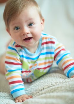cute  little newborn baby smilling  at home