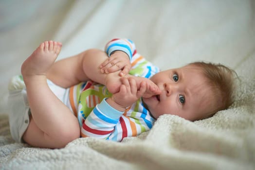 cute  little newborn baby smilling  at home