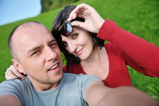 young happy couple have fun outdoor in nature