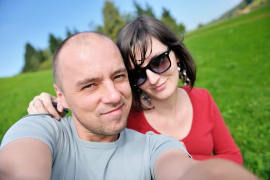 young happy couple have fun outdoor in nature