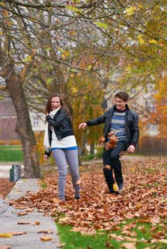 romantic young couple have fun in city park at autumn season