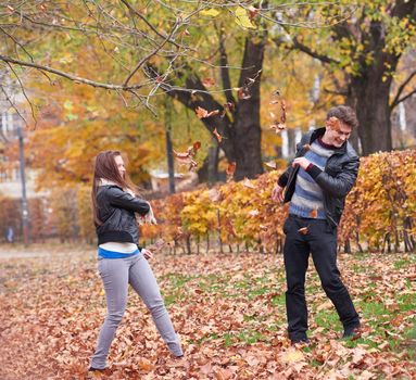 romantic young couple have fun in city park at autumn season