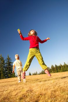 happy child jumping in nature