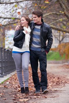 romantic young couple have fun in city park at autumn season