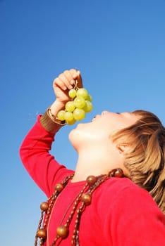 happy girl withy grape outside