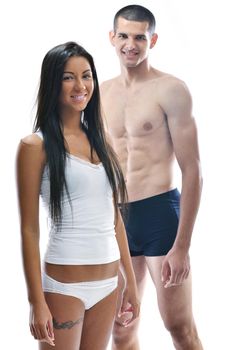 young couple isolated on white in fashionable underwear and blue jeans clothing