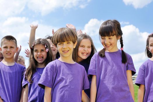 happy kids group have fun in nature outdoors park