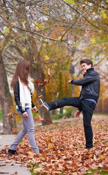 romantic young couple have fun in city park at autumn season