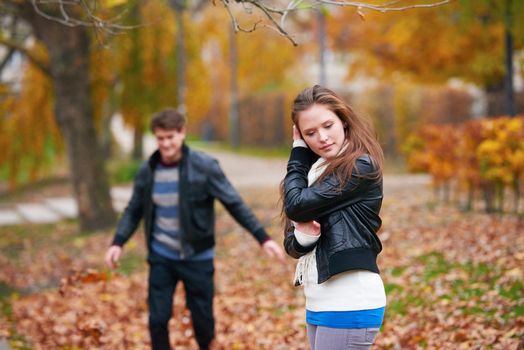 romantic young couple have fun in city park at autumn season