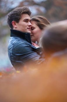 romantic young couple have fun in city park at autumn season