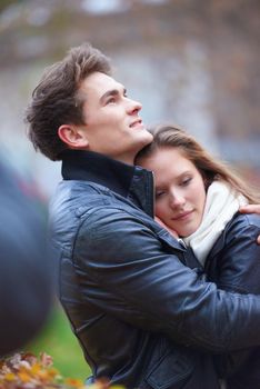 romantic young couple have fun in city park at autumn season