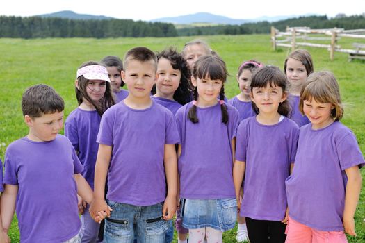 happy kids group have fun in nature outdoors park