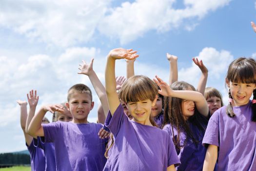 happy kids group have fun in nature outdoors park