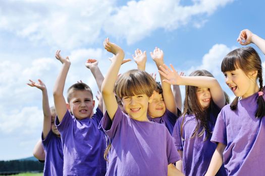 happy kids group have fun in nature outdoors park