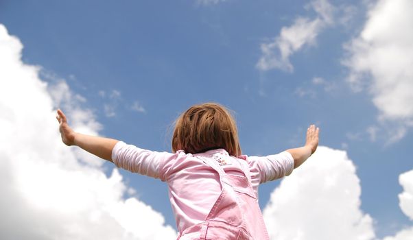 girl with arms wide open and sky background (Multiple values)