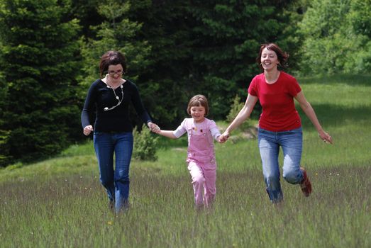 happy girls running in nature   (NIKON D80; 2.6.2007; 1/800 at f/6; ISO 320; white balance: Auto; focal length: 165 mm)