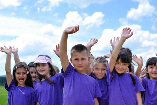 happy kids group have fun in nature outdoors park