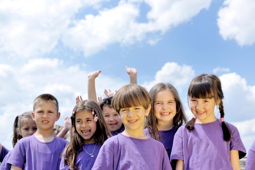 happy kids group have fun in nature outdoors park