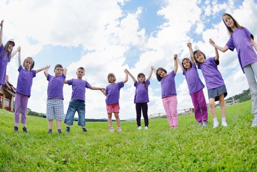 happy kids group have fun in nature outdoors park