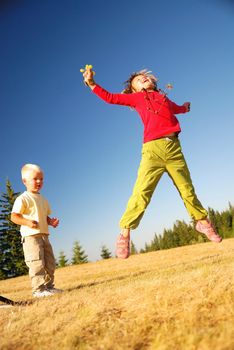 happy girl jumping in nature